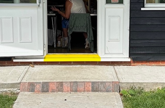 close up of step onto green via fire door